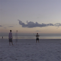 Still from Football, Shell Bird, super imposing people on the beach playing football.
