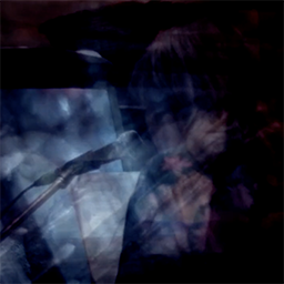 Still from Tania, Justin, consisting of layered, colourized images of Tania Gill playing piano.